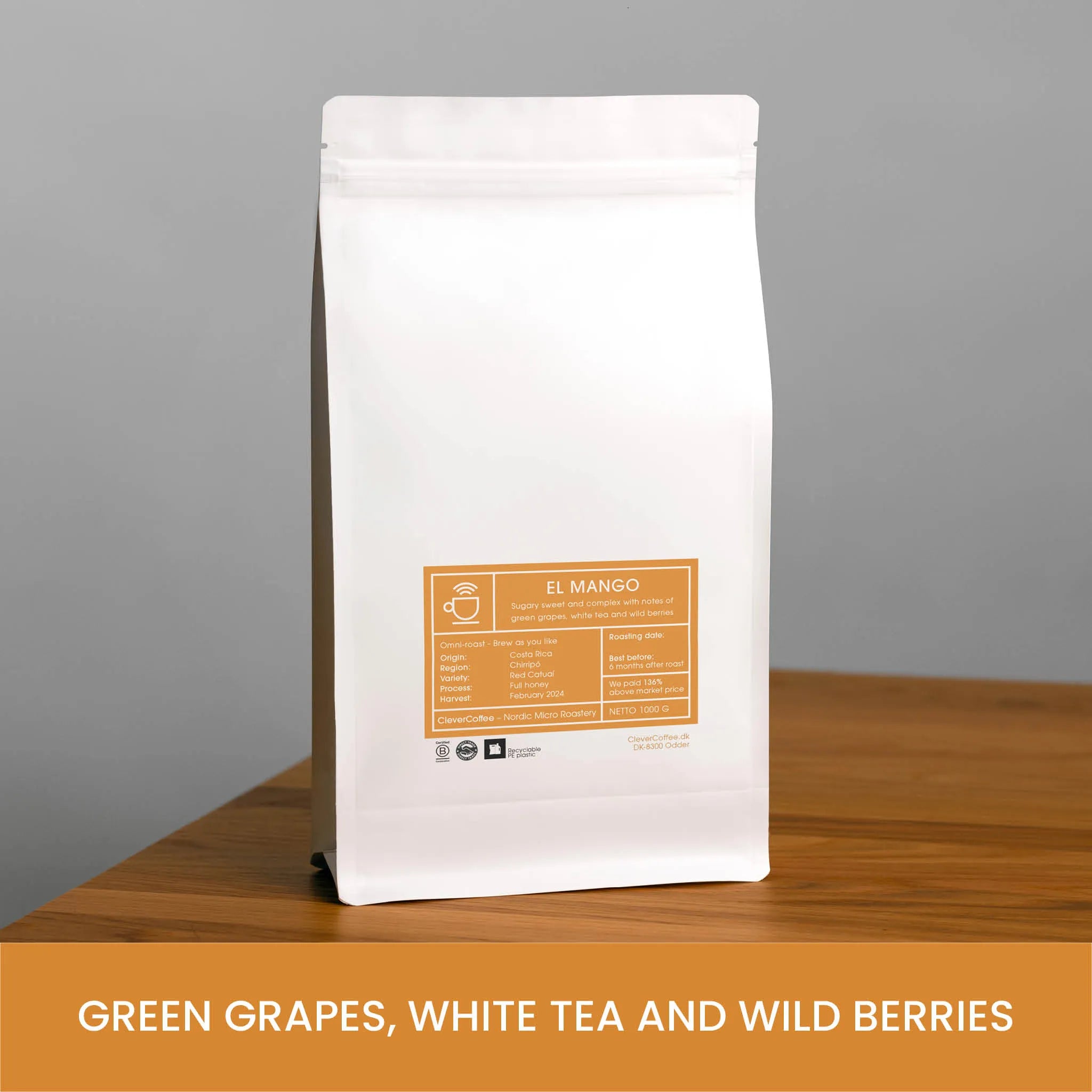 El Mango kaffepose, med tekst "Green Grapes, White Tea and Wild Berries".