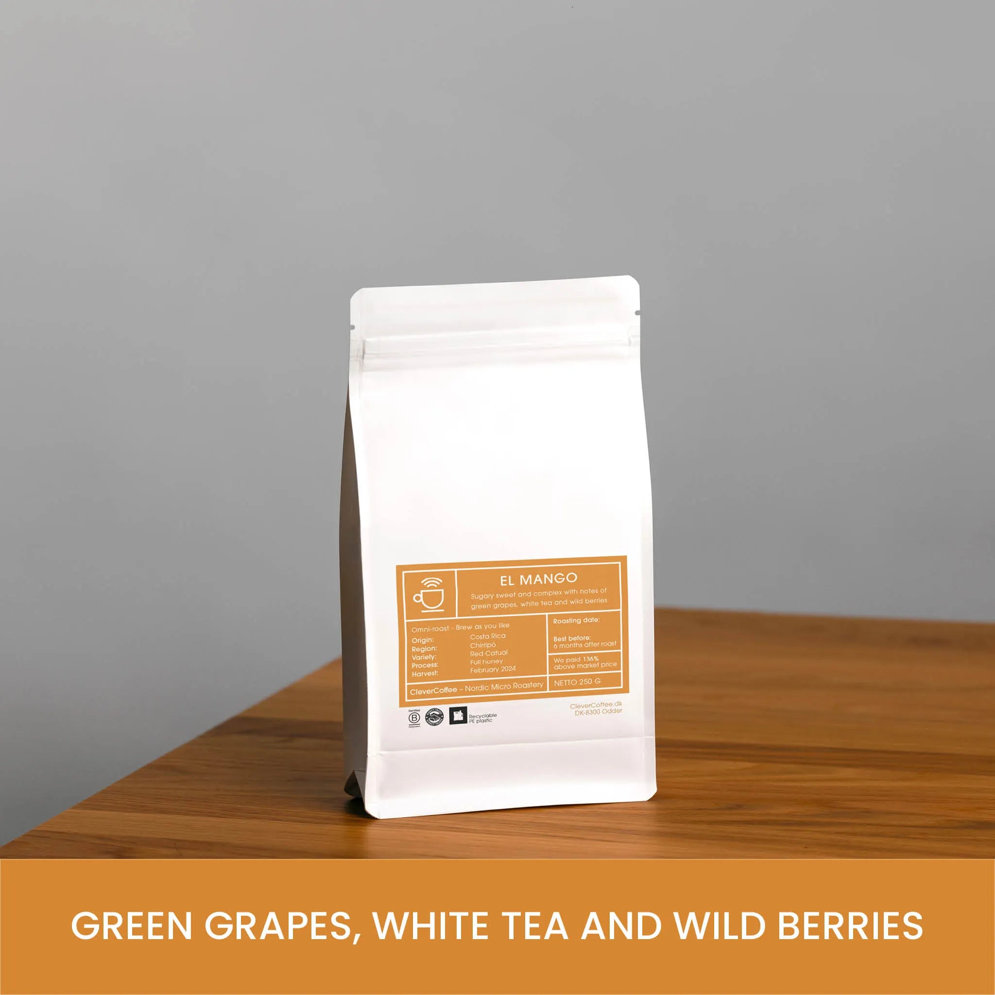 El Mango kaffepose, med tekst "Green Grapes, White Tea and Wild Berries".