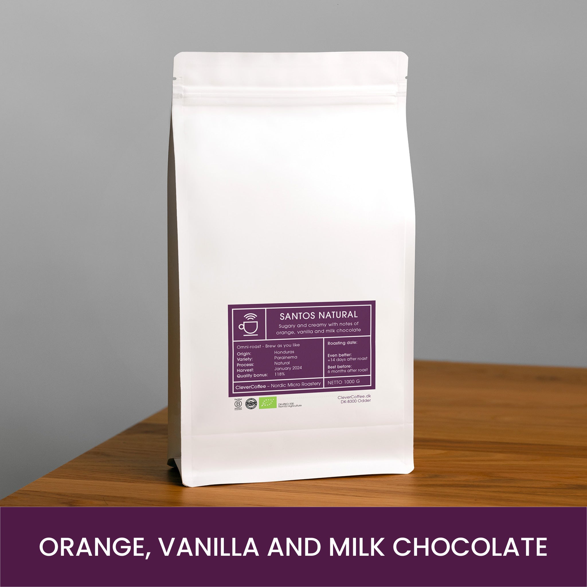 Santos Natural kaffepose, med tekst: "Orange, Vanilla and Milk Chocolate".